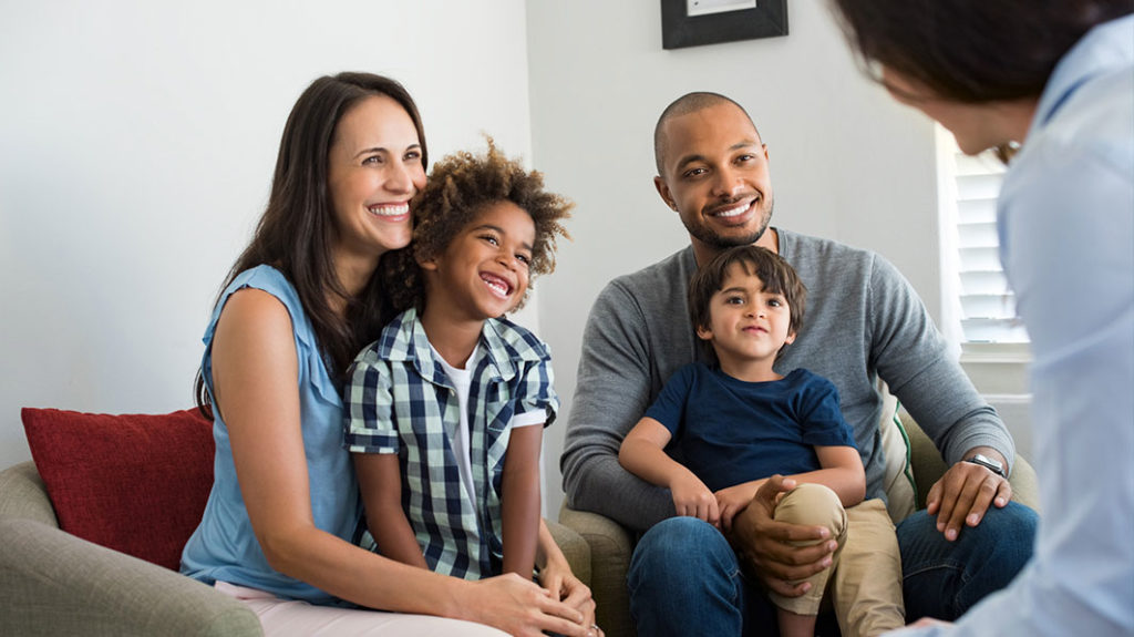 Foster family chats with a family friend.