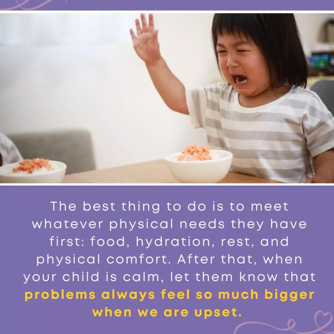 A young child sits at a table crying and raising their hand near a bowl of food, illustrating how emotional overwhelm can contribute situations that create opportunity for dishonesty.