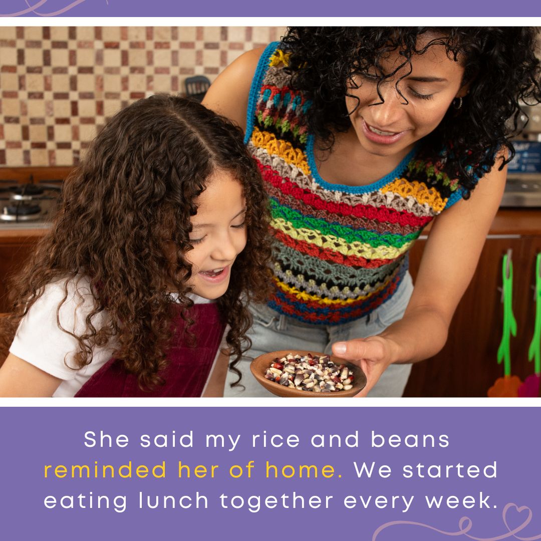 A woman and a young girl smile together in a kitchen, sharing a bowl of beans, symbolizing comfort and healing from food trauma through shared meals.